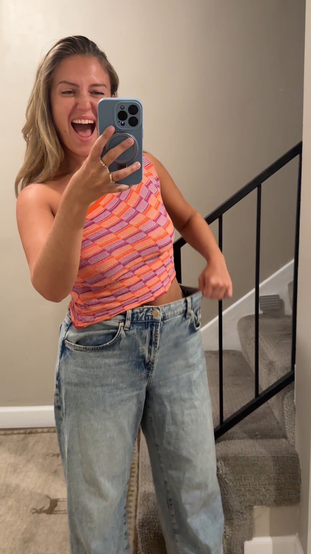 Flo customer celebrating her progress in a mirror