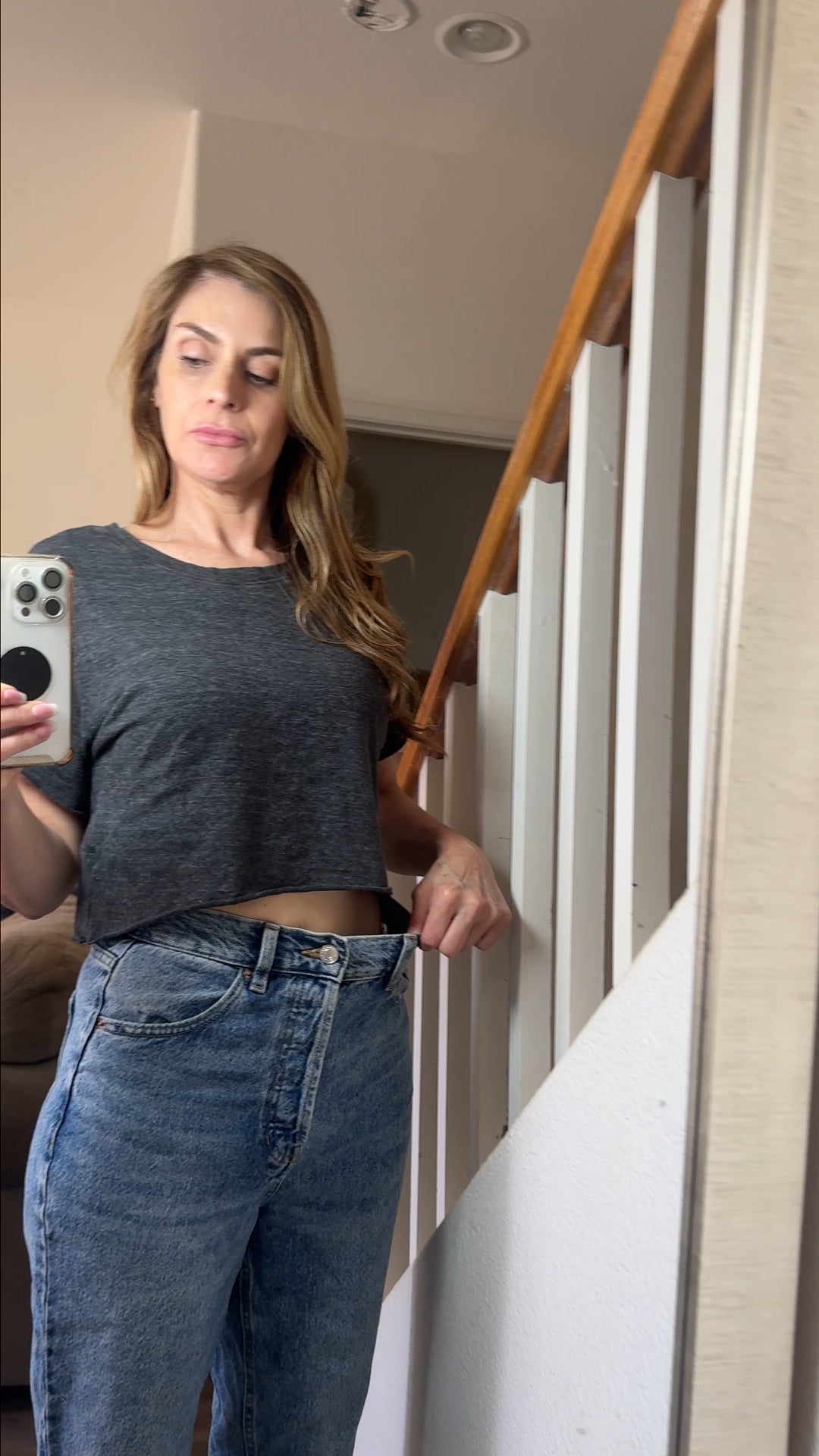 Flo customer showing her Pilates progress in a black workout set