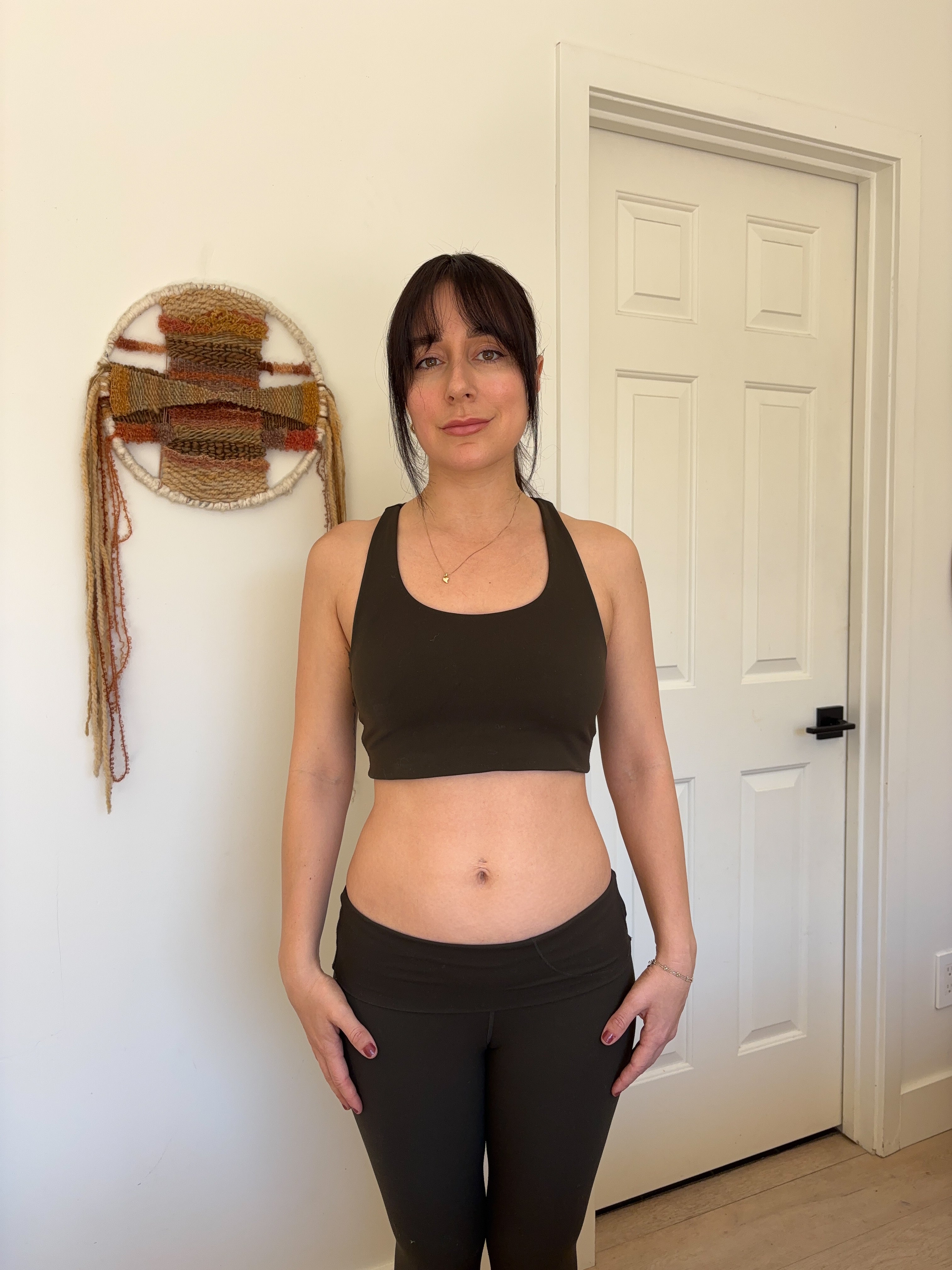 Flo customer showing her Pilates progress in a black workout set