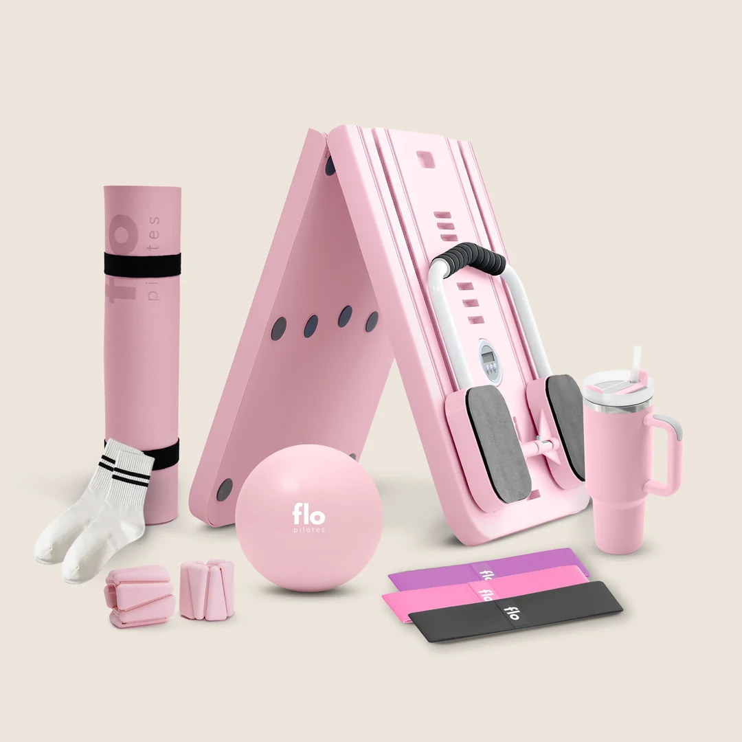 Pink Flo Pilates Reformer with included accessories